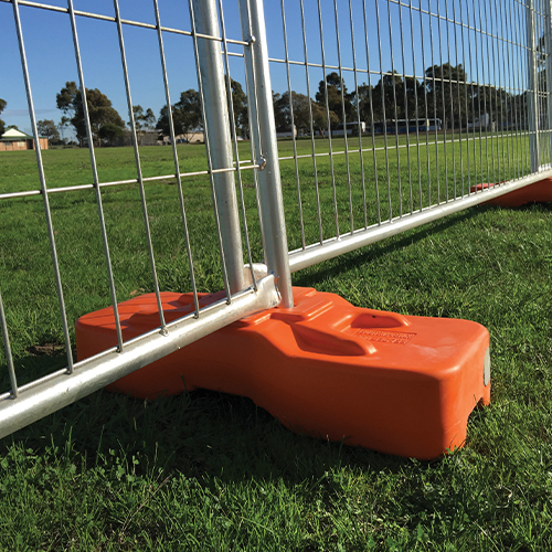temporary-fencing-panels-on-a-orange-colour-temporary-fence-foot-which-is-blown -moulded-concrete-filled-25kg